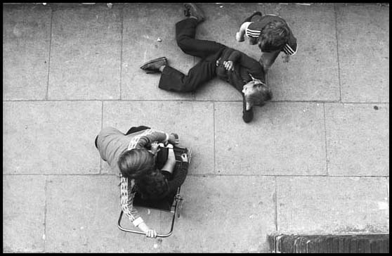 looking down at kids from the landing above